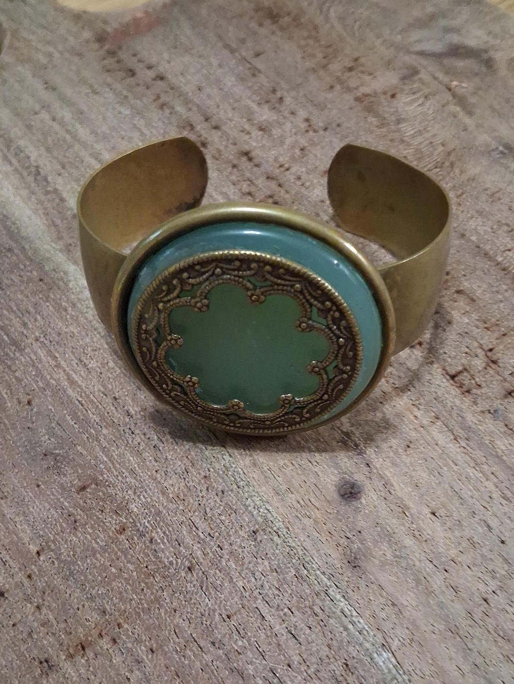 Gold-Tone Cuff Bracelet with Green Medallion
